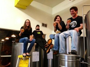 The brewmasters of Altitude Chophouse enjoy one of their pilot beers they just brewed up!
